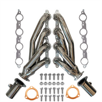 Set of stainless steel shorty headers exhaust pipes with gaskets and bolts on a white background